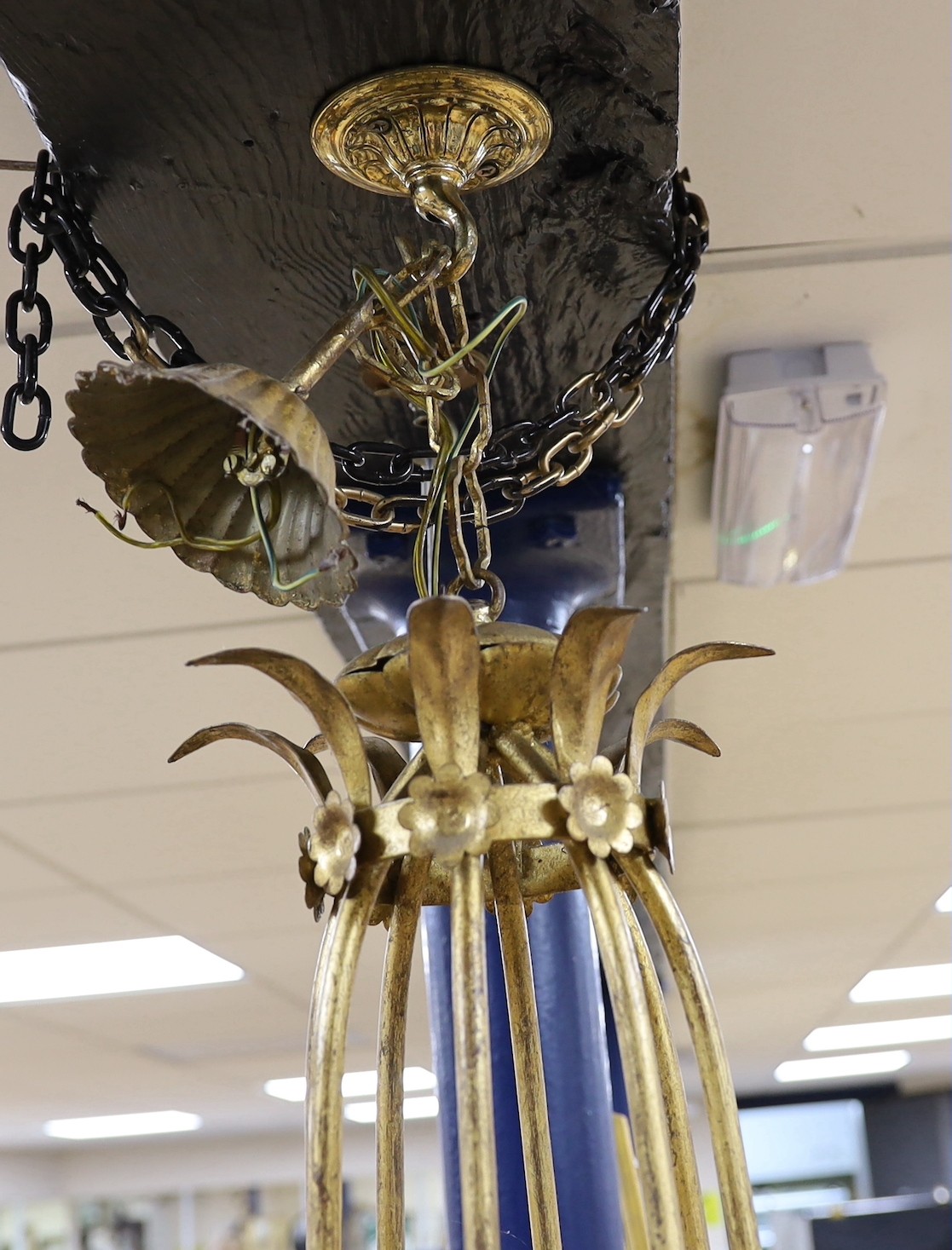 A gilt metal six light basket shaped ceiling chandelier